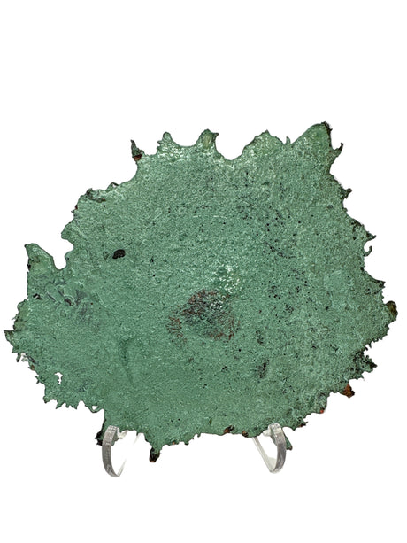 Fully patinated green back side of a Michigan splash copper piece with jagged spiked edges