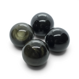 Rare Earth Gallery polished goldsheen obsidian spheres with natural golden metallic shimmer on a white background