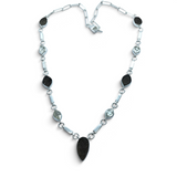 Rare Earth Gallery Agni Manitite Pearl of Fire tektite necklace with five rough geometric stones in silver bezels.