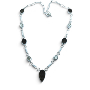 Rare Earth Gallery Agni Manitite Pearl of Fire tektite necklace with five rough geometric stones in silver bezels.