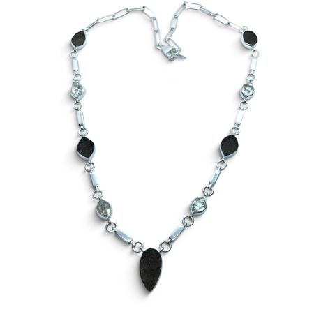 Rare Earth Gallery Agni Manitite Pearl of Fire tektite necklace with five rough geometric stones in silver bezels.