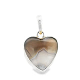 Botswana agate heart pendant in silver bezel, gray-brown banding with pale quartz center