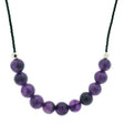 Amethyst 6mm bead necklace on black cord with silver faceted accent beads, mottled purple stones shown close up