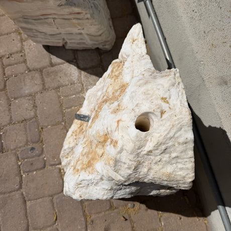 Drilled water outlet hole in the top of the cream fossil onyx fountain, viewed from above