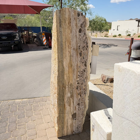 Peach watercolor back of the ice onyx and caliche vertical fountain, banded stone with dark embedded clasts