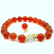 Carnelian round-bead bracelet with a green aventurine bead, gold accents and butterfly charm