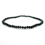Black spinel beaded bracelet of 3mm faceted dark rounds shown in a ring