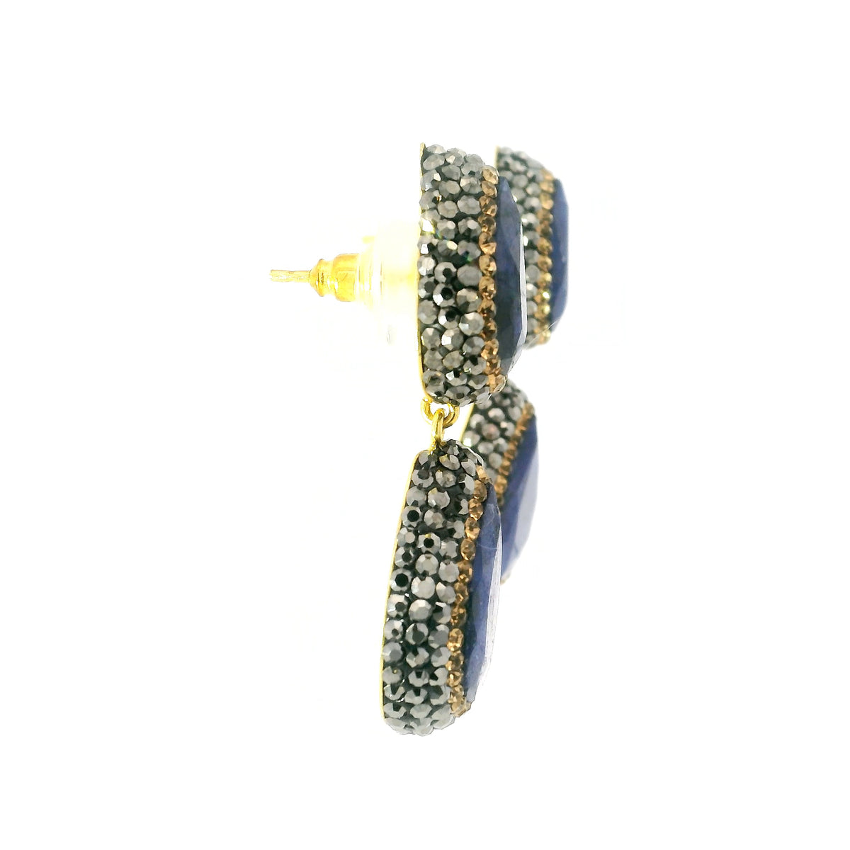 Side profile of blue sapphire two-pear dangle earrings showing gold posts and crystal-set drops