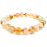 8mm round citrine bead bracelet with translucent golden beads on a white background