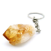 Raw citrine crystal point keychain with golden tip on a silver chain and split ring