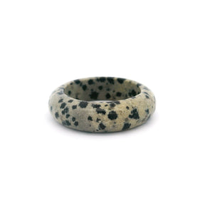 Dalmatian jasper gemstone ring in size 5.5, featuring a smooth, rounded band with black and cream speckles.