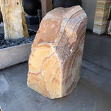 Red Sunset onyx and travertine fountain showing golden radial arcs in the gallery fountain display