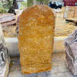 Green gray onyx gold travertine fountain standing upright, honey-gold cosmic swirl face, outdoor stone yard