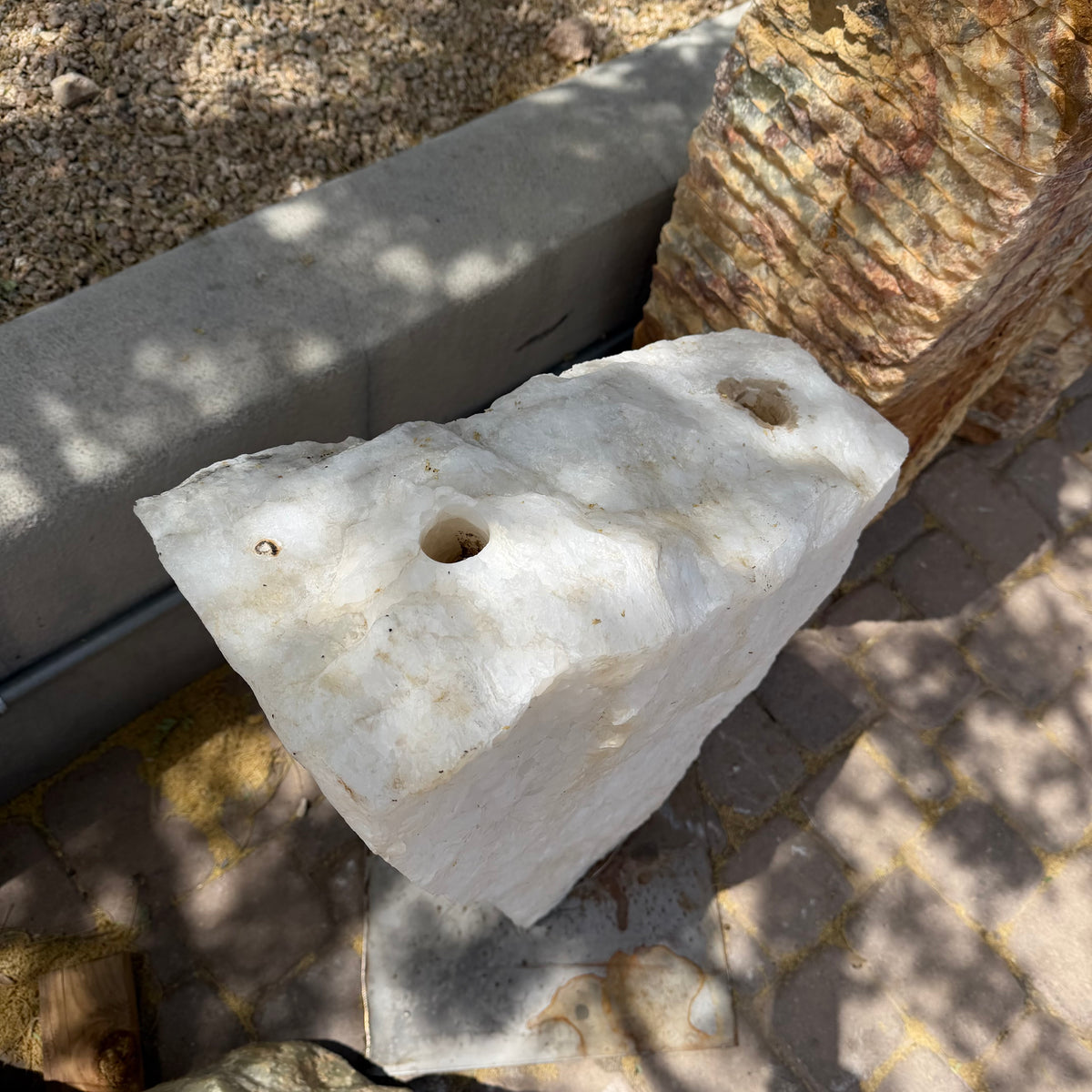 Top of the Ice White Onyx Fountain showing the two drilled water holes and pin hole in the cut surface