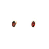 Faceted Garnet Stud Earrings - Oval With Simple Silver Bezel