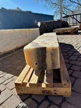 End of the cosmic onyx fountain pillar showing the drilled center pin hole and creamy banded cut face