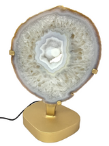 Periwinkle Agate Druze Slice with Dense Banding On Illuminated Table Stand