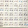 Gemstone studs 4mm rounds display grid with many colored stone pairs including turquoise, amethyst, tiger's eye and onyx