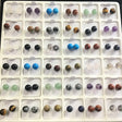 Display tray of 8mm gemstone stud earrings in many stone varieties, round polished cabochons