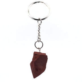 Brick-red jasper point on silver split-ring keychain, angled hanging view