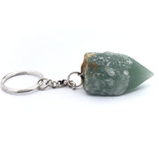 Green aventurine point on silver keychain, resting on its side