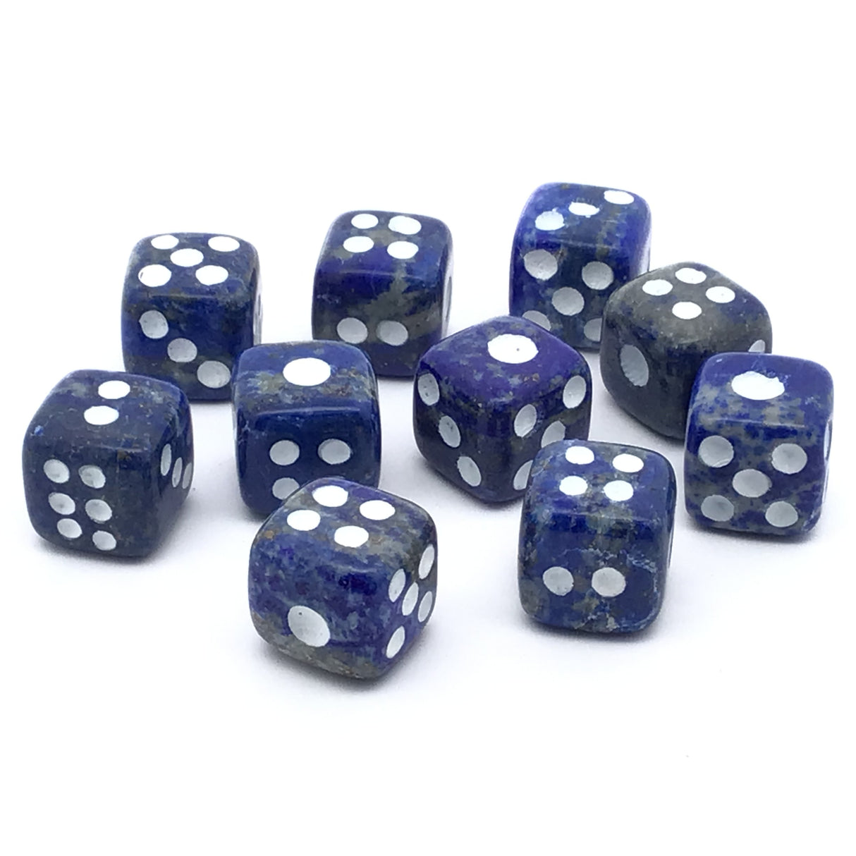 Lapis lazuli dice carvings set of 10 in blue and purple with white dots, arranged on a white background.