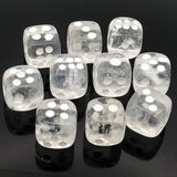 Clear quartz dice carvings set of 10, featuring translucent white dice with silver dots on a black reflective surface.