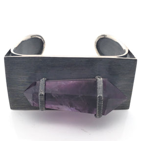 Amethyst double-terminated point wire-wrapped on the oxidized 925 sterling silver cuff, front view