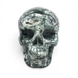 Green and white moss agate skull carving, front view with dark dendritic veining and druzy quartz pockets