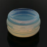 Side view of an opalite gemstone sphere stand disc showing its stacked ring profile in milky blue and gold