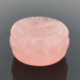 Rose quartz gemstone sphere stand disc with concave cradle, photographed on a soft gray gradient