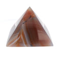 Orange carnelian-toned dyed agate pyramid carving with red banding and quartz