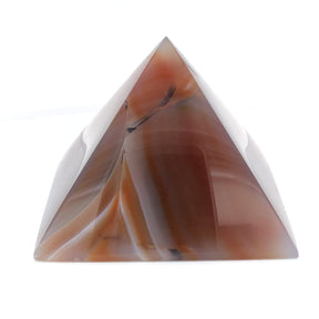 Orange carnelian-toned dyed agate pyramid carving with red banding and quartz
