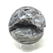 Sphalerite sphere angled to reveal an open druzy-lined cavity edged by pearly banded blades