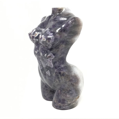 Rare Earth Gallery 10" Chevron Amethyst female torso carving with purple and white banded patterns and geometric striations.