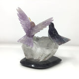 Hand-Carved Purple Fluorite & Amethyst Hummingbird Duo Perched on Faceted Quartz & Lodolite Phantom Crystal with Black Marble Base