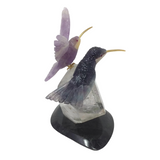 Hand-Carved Purple Fluorite & Amethyst Hummingbird Duo Perched on Faceted Quartz & Lodolite Phantom Crystal with Black Marble Base