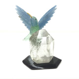 Hand-Carved Blue Calcite & Green Fluorite Hummingbird Perched on Lodolite Quartz Crystal with Black Marble Base