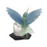 Hand-Carved Blue Calcite & Green Fluorite Hummingbird Perched on Lodolite Quartz Crystal with Black Marble Base