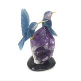 Hand-Carved Blue Calcite Hummingbird Duo Perched on Gemmy Amethyst Crystal Point with Black Marble Base