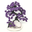 Amethyst gemstone tree with clay polymer trunk on a pale quartz druze geode base with purple clusters