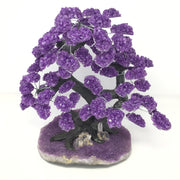 Amethyst gemstone chip tree with dark polymer trunk on an amethyst druze plaque base