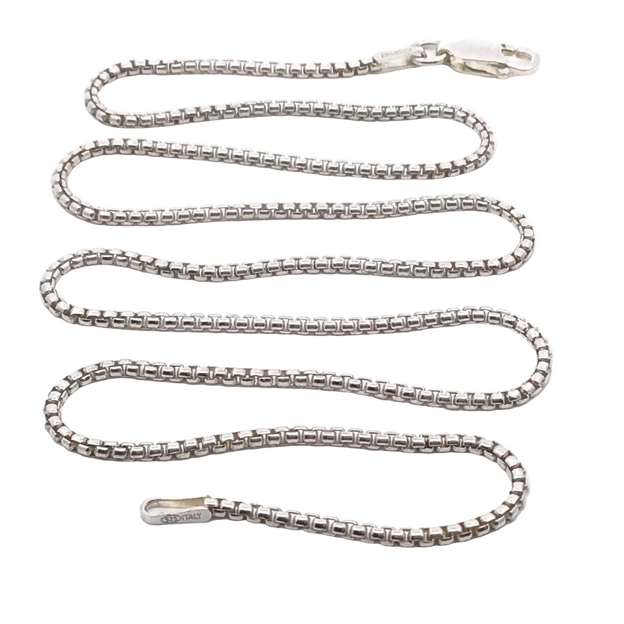 18-inch 1.3mm round box chain looped on white with its 925 Italy stamped end tag visible