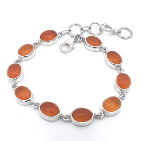 Citrus carnelian oval bracelet coiled in a loop with lobster clasp and extender chain