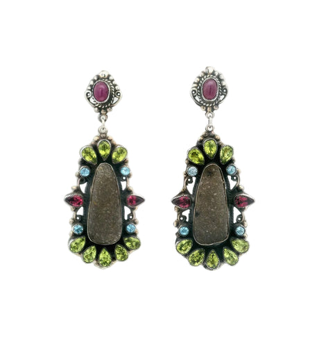 Pair of earrings with gemstones on a white background