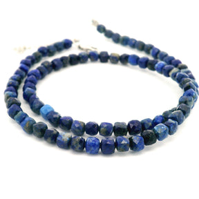 Faceted lapis lazuli cube bead necklace in deep blue with gold flecks