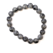 Larvikite 10mm bracelet featuring round gray-black beads arranged in a circular shape on a white background.