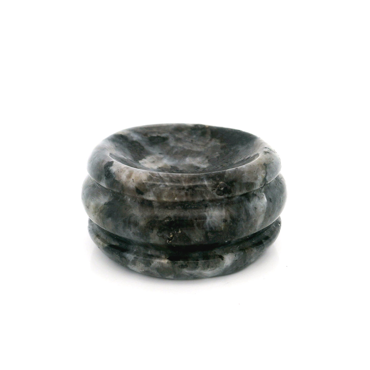 Dark gray and black speckled gemstone sphere stand disc with polished grooved rim on white