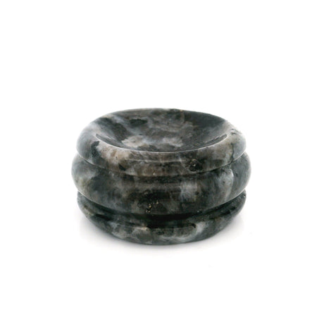 Dark gray and black speckled gemstone sphere stand disc with polished grooved rim on white