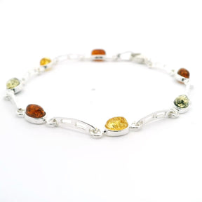 Silver bracelet with multicolored gemstones on a white background